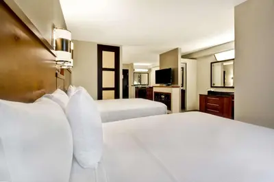 a hotel room with two beds and a television at Hyatt Place Columbus Worthington in Worthington