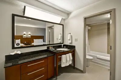a bathroom with a sink and a mirror at Hyatt Place Columbus Worthington in Worthington