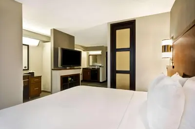 a hotel room with a large bed and a television at Hyatt Place Columbus Worthington in Worthington