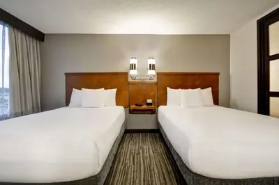 a hotel room with two beds and a window at Hyatt Place Columbus Worthington in Worthington
