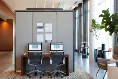 an office with two computer monitors on a desk at AC Hotel Columbus Dublin in Dublin