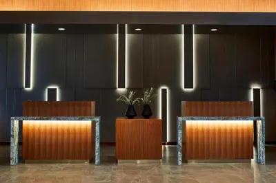 a lobby with two chairs with plants on them at AC Hotel Columbus Dublin in Dublin