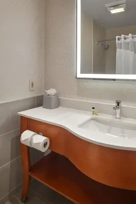 a bathroom with a sink and a mirror at Holiday Inn Express - Akron NW - Fairlawn by IHG in Akron