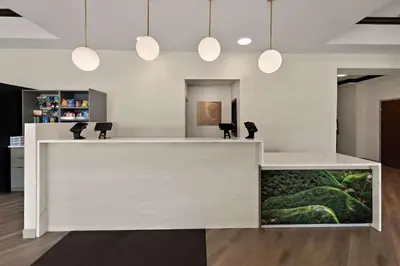 a reception desk with a fish tank in a room at Comfort Suites Columbus East Broad in Columbus