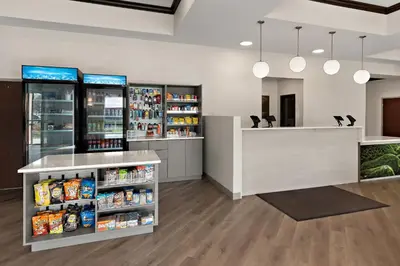 a pharmacyacist with a counter and shelves of food at Comfort Suites Columbus East Broad in Columbus