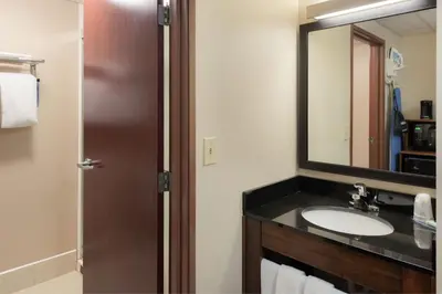 a bathroom with a sink and a mirror at Fairfield Inn & Suites by Marriott Dayton Troy in Troy