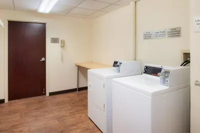 an office with a washer and dryer and a door at Fairfield Inn & Suites by Marriott Dayton Troy in Troy