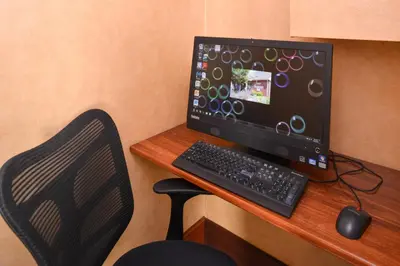a computer monitor and a keyboard and mouse on a desk at Residence Inn by Marriott Dayton Troy in Troy