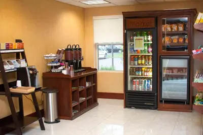 a store with a cash register and a drink cooler at Residence Inn by Marriott Dayton Troy in Troy