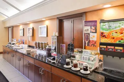 a restaurant with a counter with a unintention at Residence Inn by Marriott Dayton Troy in Troy