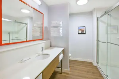 a bathroom with a sink and a glass shower at Hampton Inn & Suites Oakwood Village-Cleveland in Oakwood