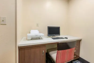 a desk with a computer and a printer on it at Comfort Inn Grove City - Columbus South in Grove City