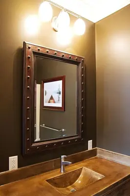 a bathroom with a large mirror over a sink at Wishmaker House B&b in Bellville