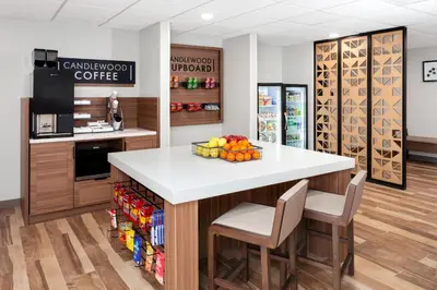 a kitchen with a counter with a fruit bowl on it at Candlewood Suites Columbus North - Worthington by IHG in Columbus