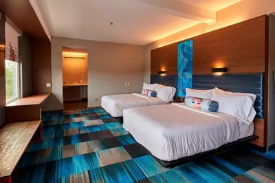 a hotel room with two beds in a room at Aloft Cleveland Airport in North Olmsted