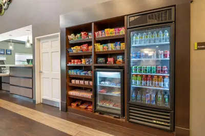 a large refrigerator filled with lots of drinks at Best Western Hilliard Inn & Suites in Hilliard