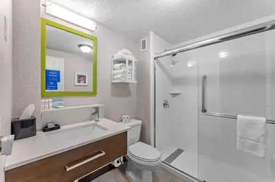 a bathroom with a toilet and a sink and a shower at Hampton Inn Cleveland-Westlake in Westlake