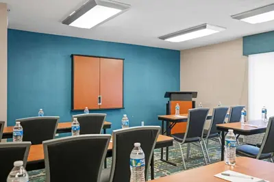 a conference room with tables and chairs with water bottles at Hampton Inn Cleveland-Westlake in Westlake