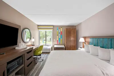 a hotel room with a bed and a flat screen tv at Hampton Inn Cleveland-Westlake in Westlake