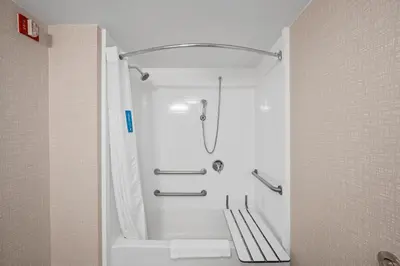 a shower in a bathroom with a bath tub at Hampton Inn Cleveland-Westlake in Westlake