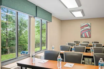 a conference room with tables and chairs and windows at Hampton Inn Cleveland-Westlake in Westlake