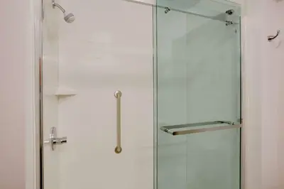 a shower stall with a glass door in a bathroom at Hampton Inn & Suites Cleveland-Independence in Independence