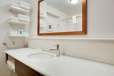 a bathroom with a sink and a mirror at Hampton Inn & Suites Cleveland-Independence in Independence