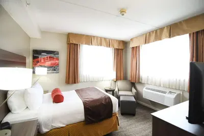 a hotel room with a bed and a television at Best Western Plus Sandusky Hotel & Suites in Sandusky