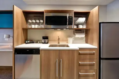 a kitchen with a sink and a microwave at Home2 Suites By Hilton Bowling Green, Oh in Bowling Green