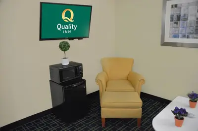 a chair and a television in a waiting room at Quality Inn & Suites Dublin in Dublin