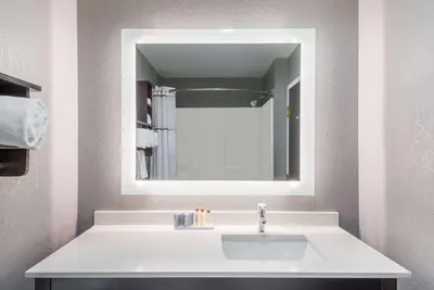 a bathroom with a white sink and a mirror at Hawthorn Extended Stay by Wyndham Columbus West in Columbus