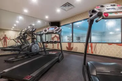a gym with two tread machines and a treadmill at Hawthorn Extended Stay by Wyndham Columbus West in Columbus