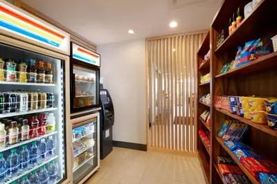 a grocery store aisle with a soda machine in a store at Holiday Inn Express & Suites - Cincinnati North - Liberty Way by IHG in West Chester