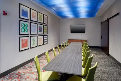 a conference room with a long table and chairs at Holiday Inn Express & Suites - Cincinnati North - Liberty Way by IHG in West Chester