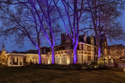 a house decorated for christmas with purple lights at The Glidden House in Cleveland