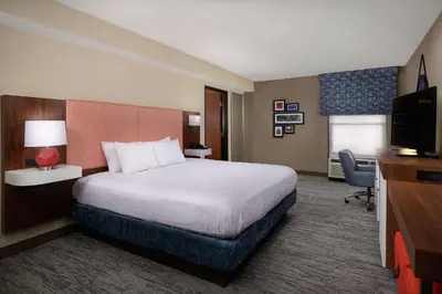 a hotel room with a bed and a television at Hampton Inn by Hilton Youngstown-West I-80 in Mineral Ridge