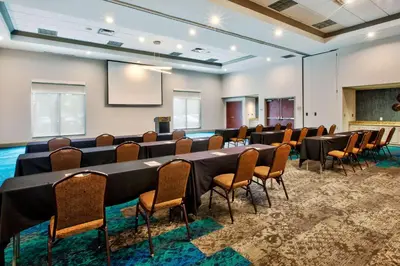 a conference room with a long table and chairs at Hilton Garden Inn Dayton/ Beavercreek in Beavercreek