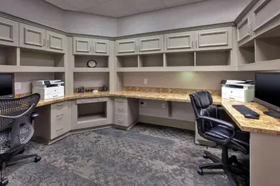 an office with two desks and two chairs and a computer at Hilton Garden Inn Dayton/ Beavercreek in Beavercreek
