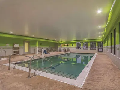 a large swimming pool in a building at La Quinta by Wyndham Cleveland Airport West in North Olmsted