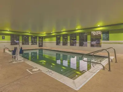 a large swimming pool in a building at La Quinta by Wyndham Cleveland Airport West in North Olmsted