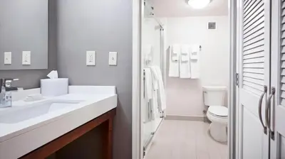 a white bathroom with a sink and a toilet at Courtyard Cincinnati Airport South/Florence in Florence