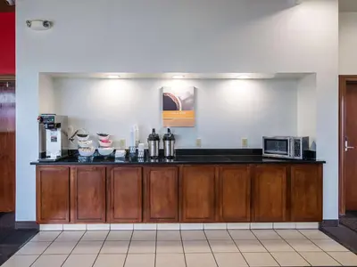 a kitchen with a counter with a microwave at Motel 6-Columbus, OH - OSU in Columbus