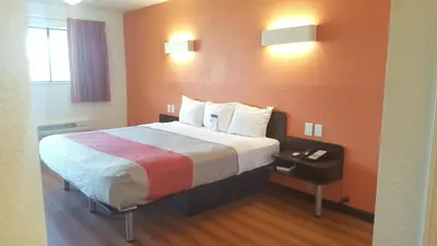 a hotel room with a bed in a room at Motel 6-Columbus, OH - OSU in Columbus