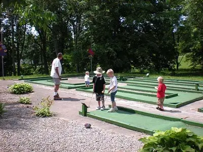 a group of children playing a game in a park at Wilmington Camping Resort in Wilmington