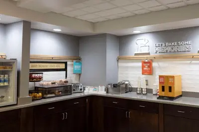 a kitchen with a counter top with a coffee maker at Hampton Inn Kent/Akron Area in Kent