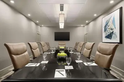 a conference room with a long table and chairs at Embassy Suites by Hilton Cleveland Rockside in Independence