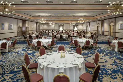 a ballroom with tables and chairs in a ballroom at Embassy Suites by Hilton Cleveland Rockside in Independence