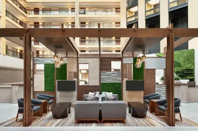 a lobby of a building with couches and chairs at Embassy Suites by Hilton Cleveland Rockside in Independence