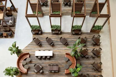 an overhead view of a restaurant with tables and chairs at Embassy Suites by Hilton Cleveland Rockside in Independence