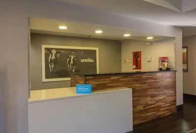 a hotel lobby with a sign that says smile at Hampton Inn Medina in Medina